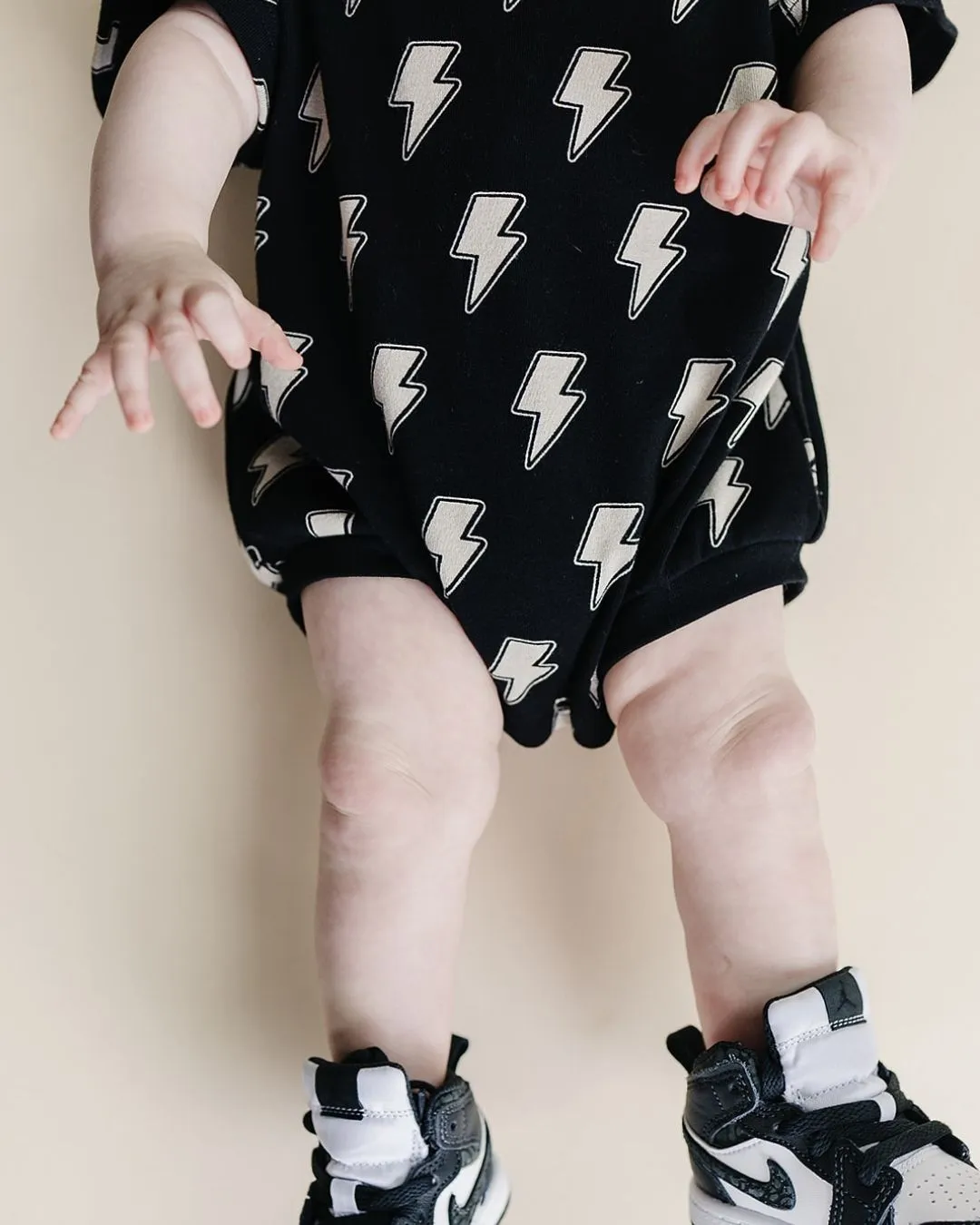 Bold Black Bolts on Short Sleeve Romper